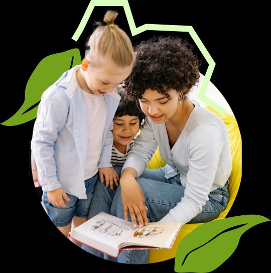 A foster carer holding a child whilst reading